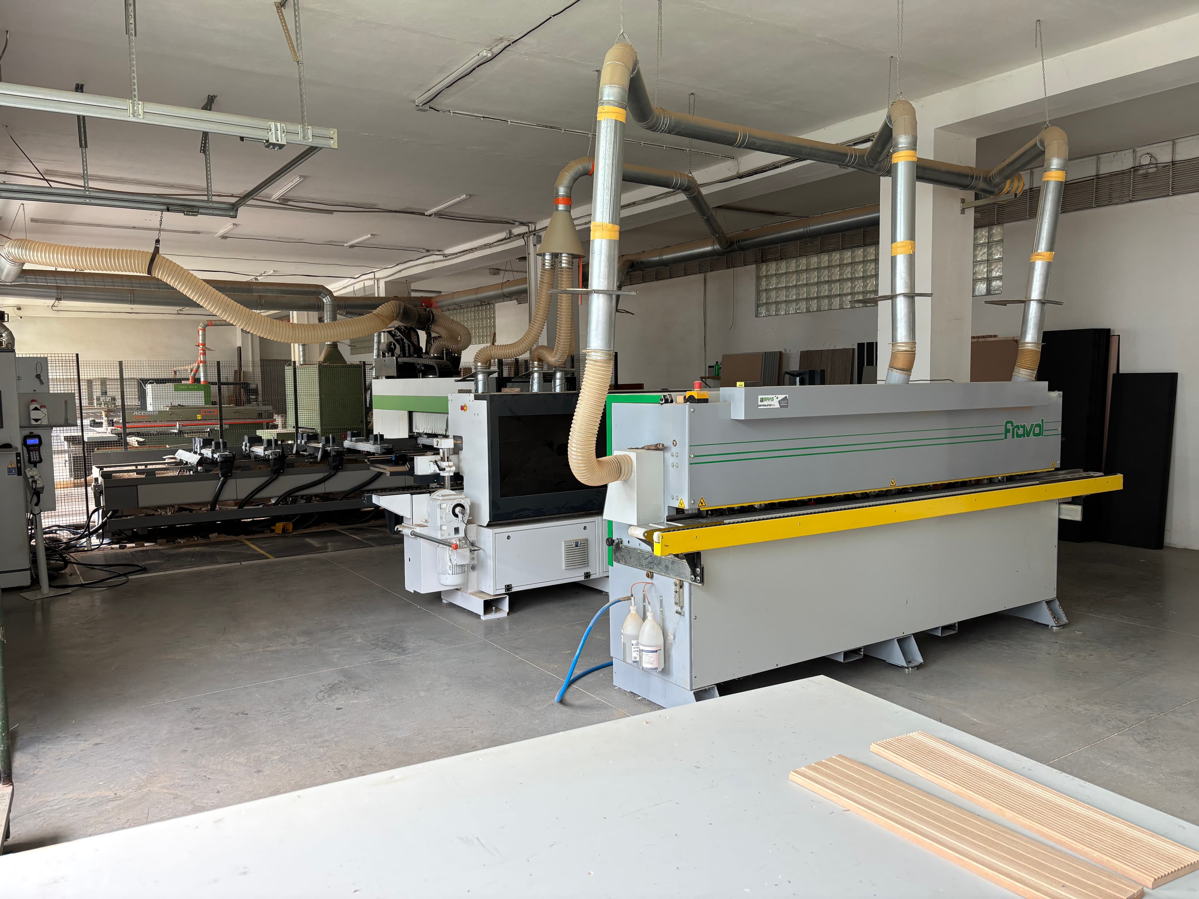 Fravol edge banding machine with overhead dust collection piping